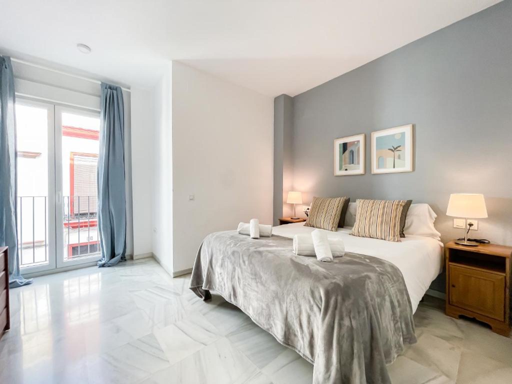 Posteľ alebo postele v izbe v ubytovaní San Marcos Apartamentos