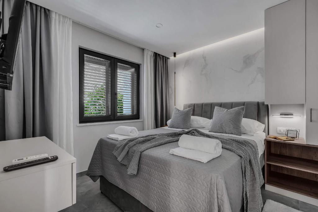 Posteľ alebo postele v izbe v ubytovaní Villa Plenus Smilje