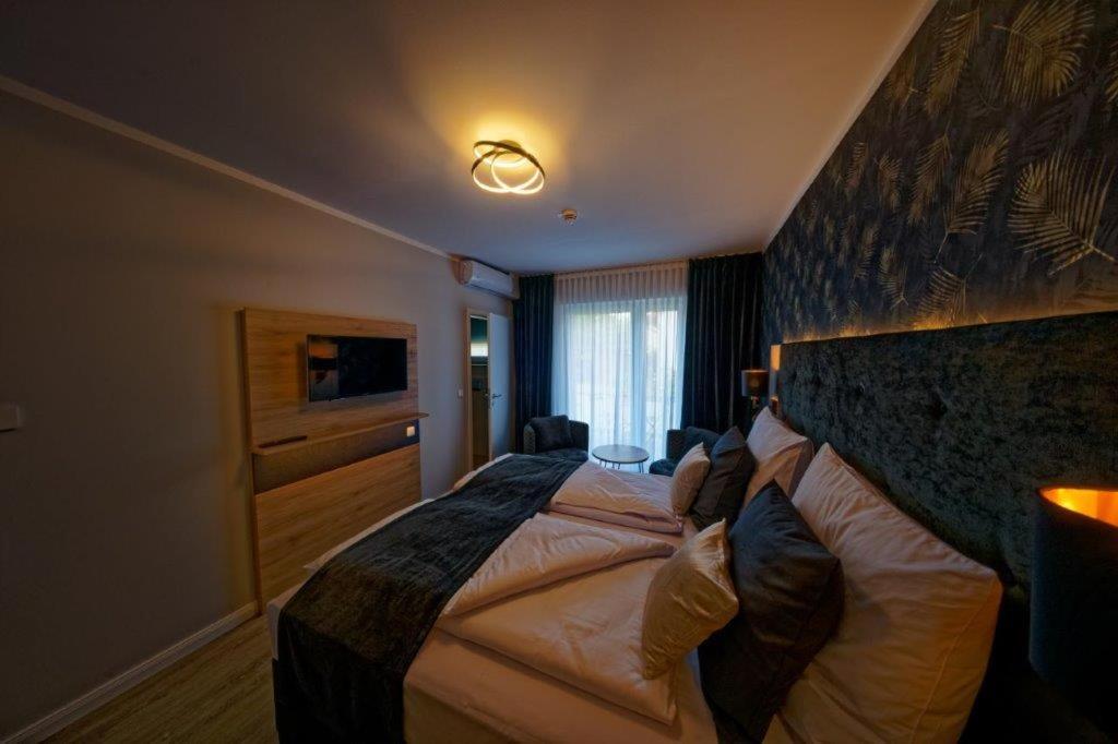Postel nebo postele na pokoji v ubytování Hotel Dea