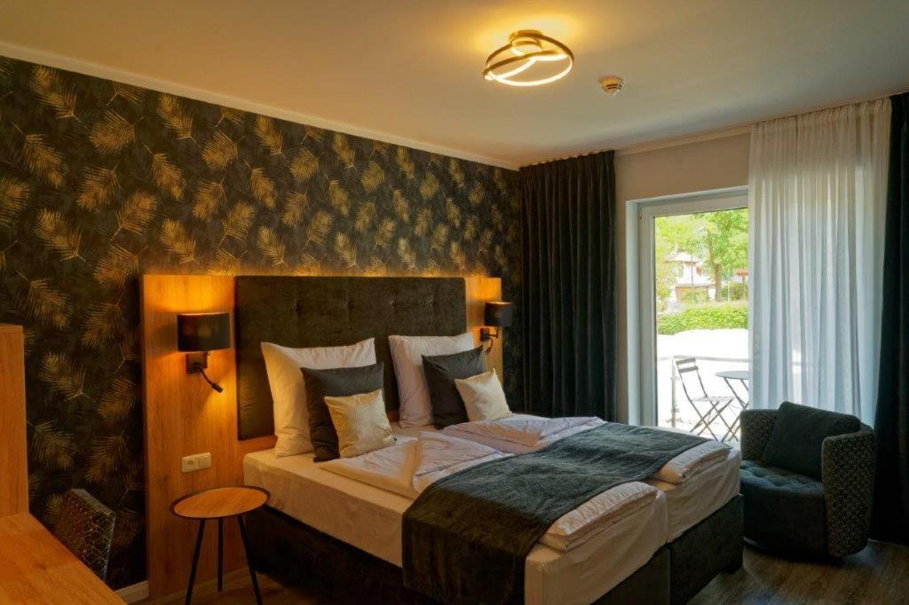 Postel nebo postele na pokoji v ubytování Hotel Dea