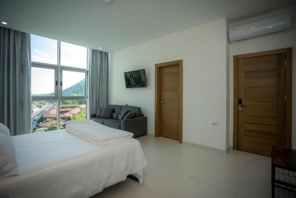 Postel nebo postele na pokoji v ubytování Sky Hotel