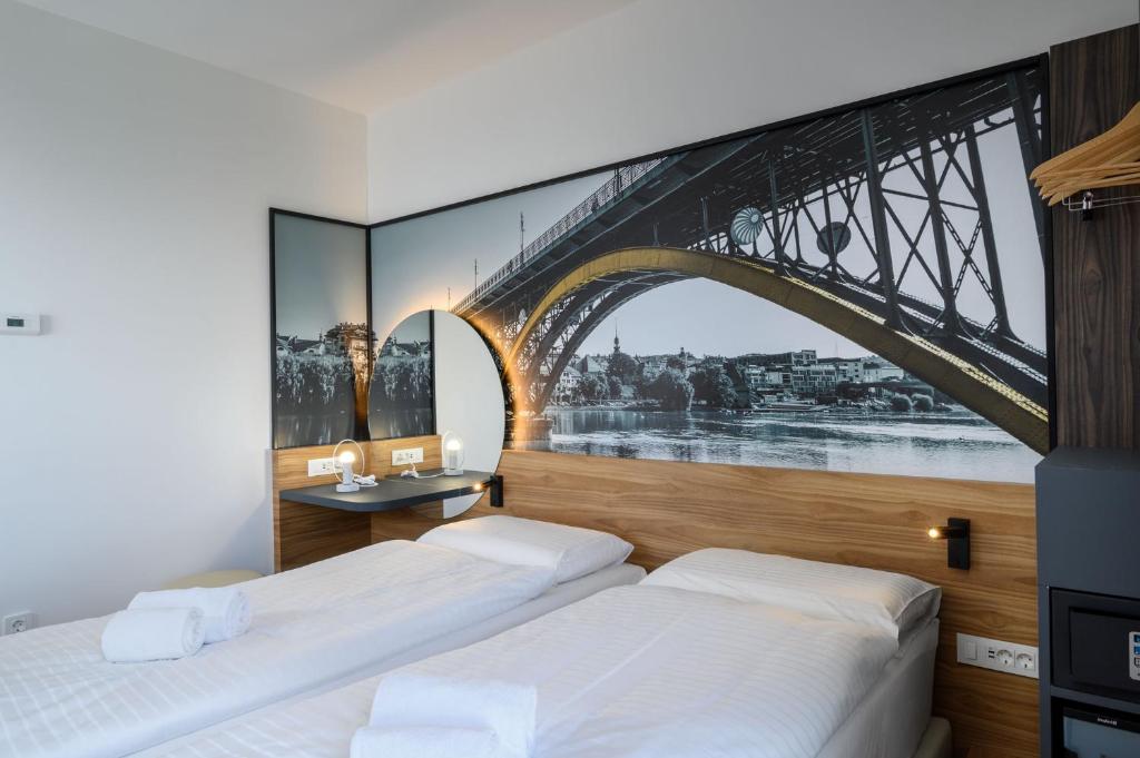 Postel nebo postele na pokoji v ubytování B&B Hotel Maribor