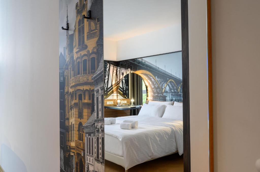 Postel nebo postele na pokoji v ubytování B&B Hotel Maribor