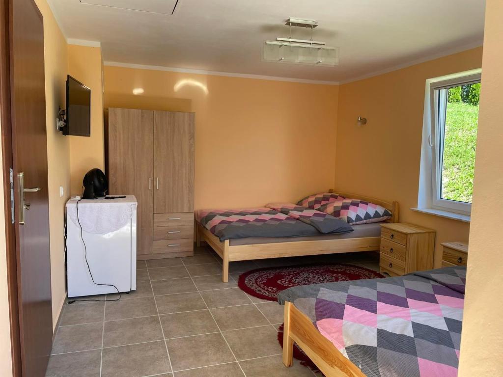 Posteľ alebo postele v izbe v ubytovaní Bajkowe Mazury Domek Wakacyjny