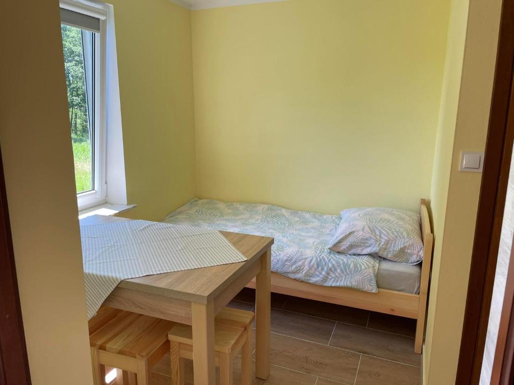 Posteľ alebo postele v izbe v ubytovaní Bajkowe Mazury Domek Wakacyjny