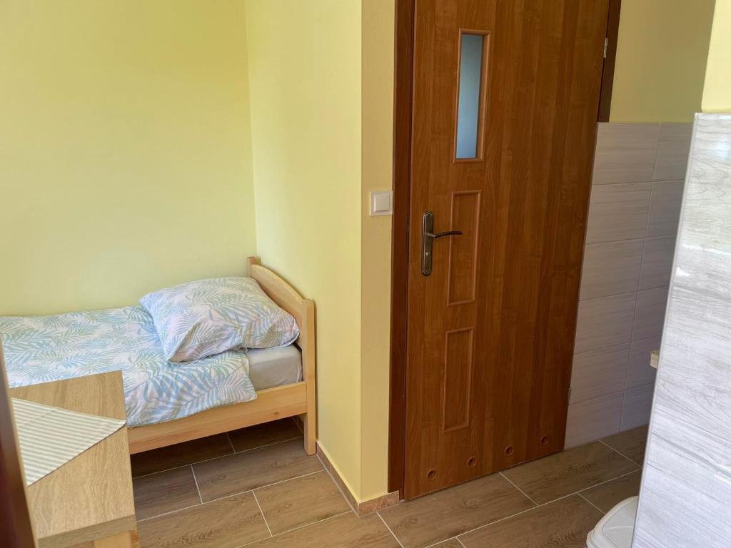 Posteľ alebo postele v izbe v ubytovaní Bajkowe Mazury Domek Wakacyjny