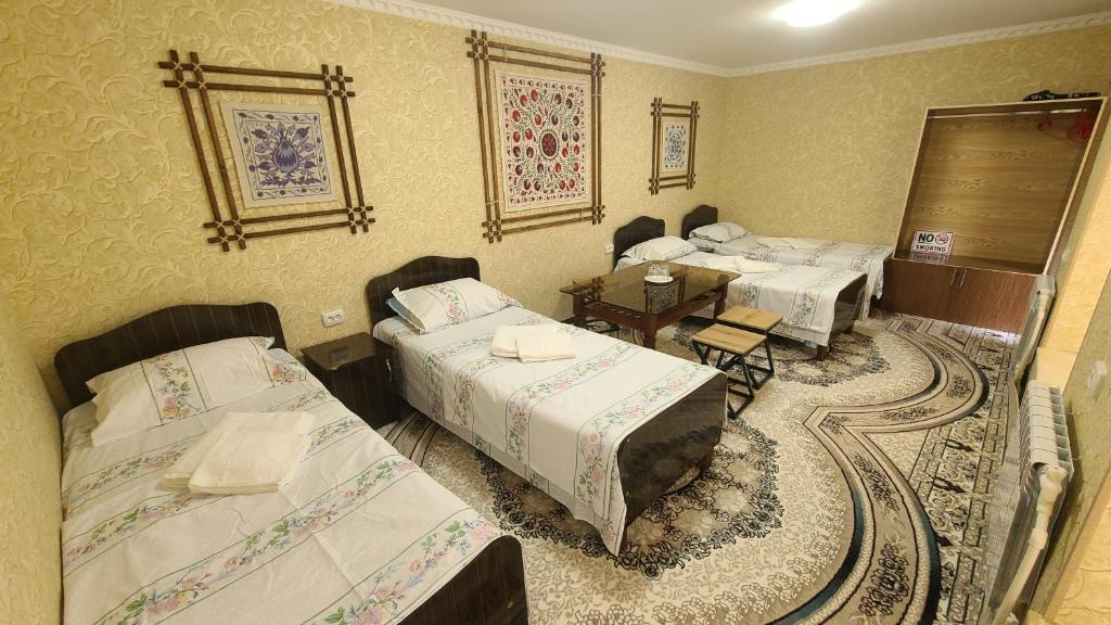 Ένα ή περισσότερα κρεβάτια σε δωμάτιο στο Marhabo Guesthouse