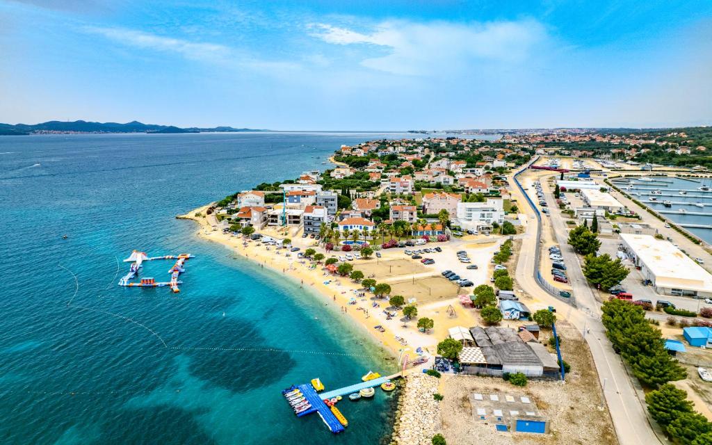 an aerial view of a beach with a resort at Apartments Villa Rudi in Bibinje
