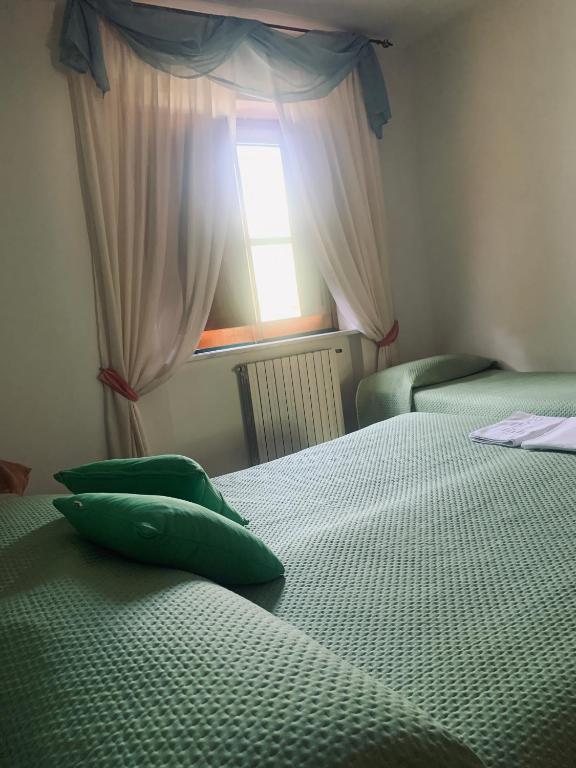 Postel nebo postele na pokoji v ubytování Residence il Varco del Pollino