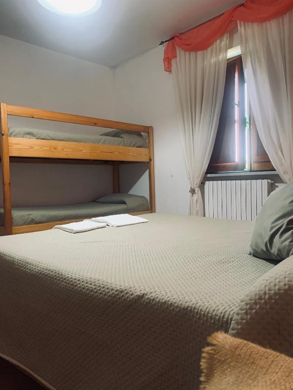Postel nebo postele na pokoji v ubytování Residence il Varco del Pollino