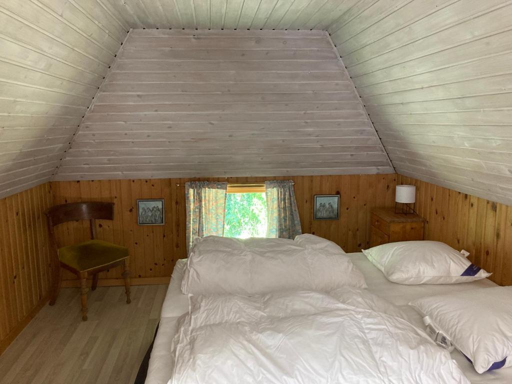 Postel nebo postele na pokoji v ubytování Mor’s hus Læsø