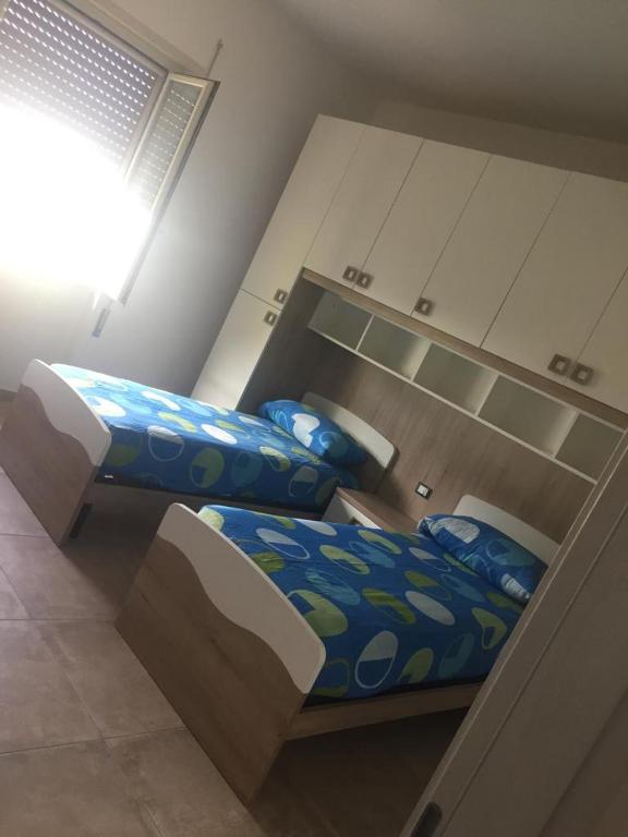A bed or beds in a room at Appartamento dei nonni di Gio e Cry