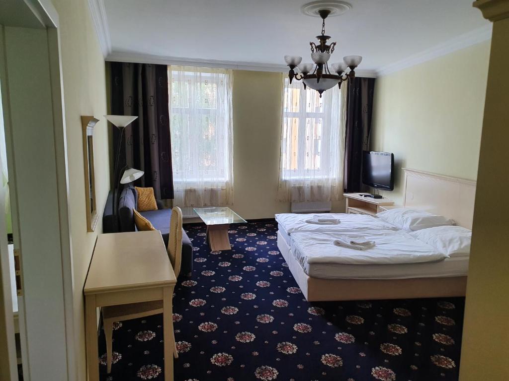 Postel nebo postele na pokoji v ubytování Evergreen apartments hotel