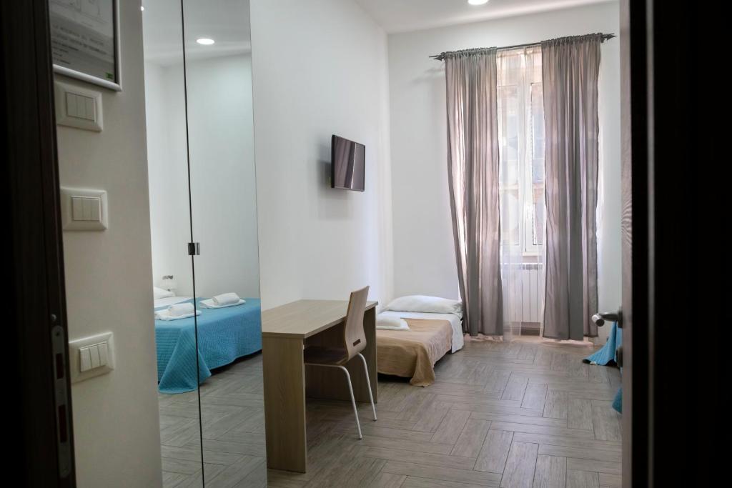 A bed or beds in a room at La residenza del Principe