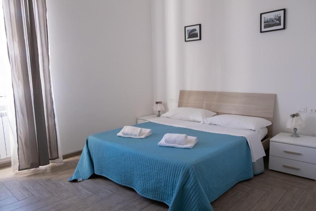 A bed or beds in a room at La residenza del Principe