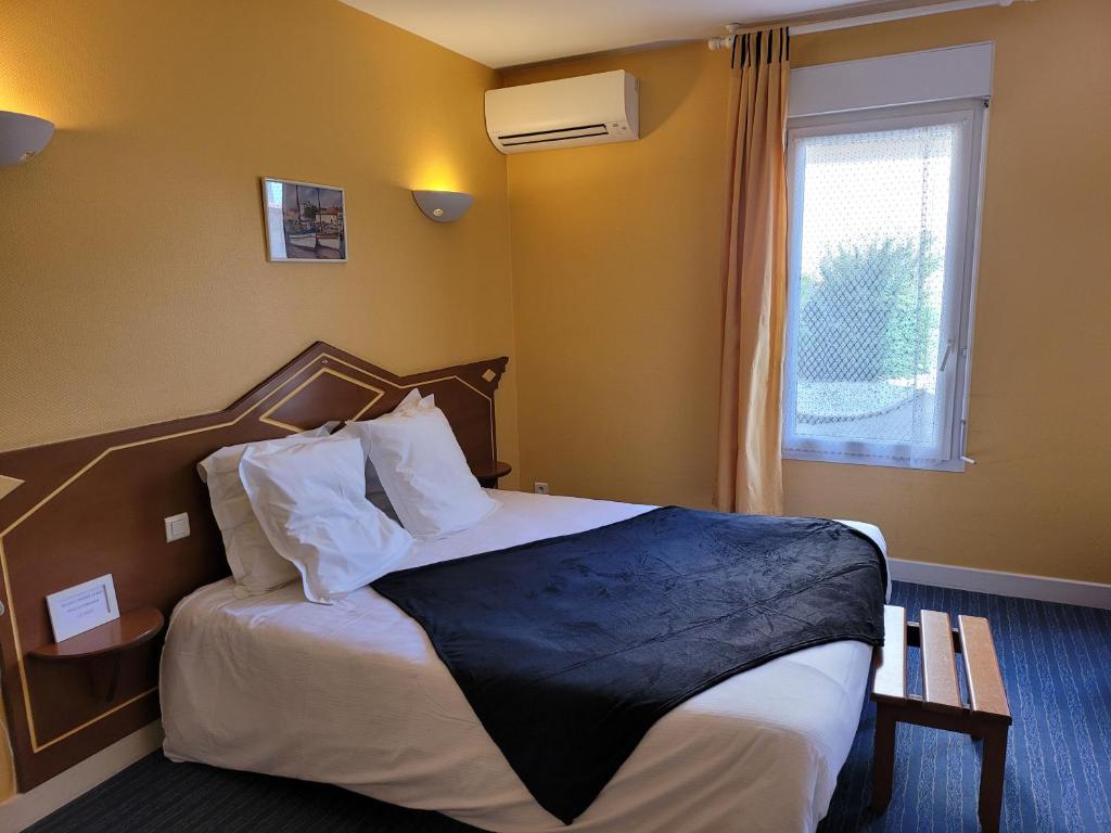 Posteľ alebo postele v izbe v ubytovaní L'AUBERGE DE L'OLIVE