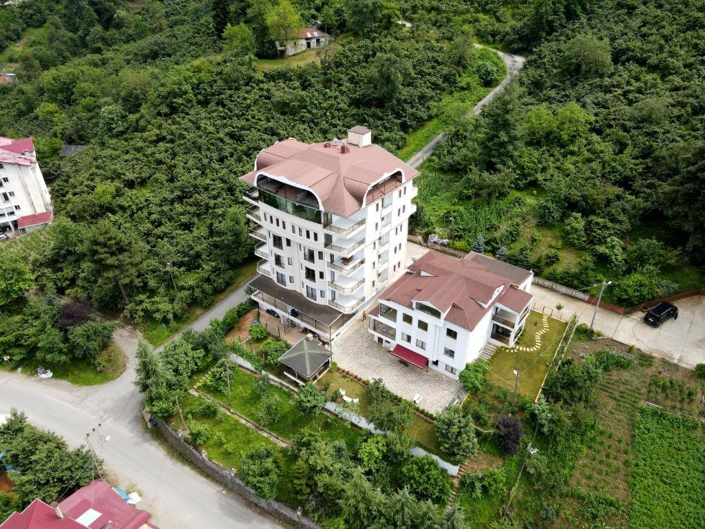 an overhead view of a large white building with a red roof at Bengisu suite apart in Trabzon