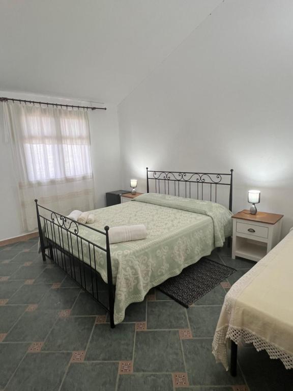 Voodi või voodid majutusasutuse Agriturismo Su Barraccu toas