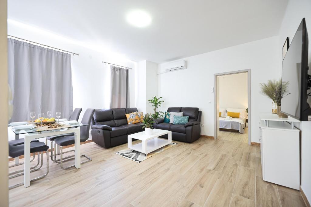 a living room with a couch and a table at Mathilda's apartment in Zadar