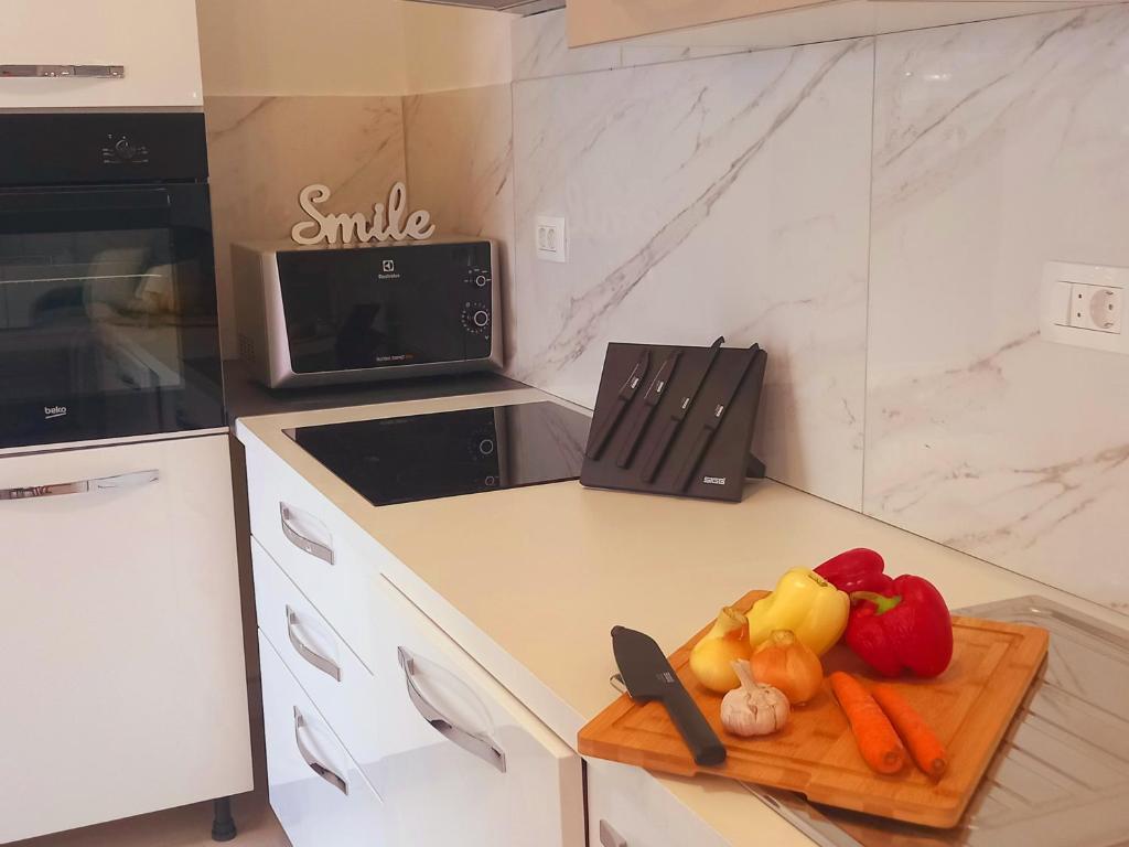 Kuchyň nebo kuchyňský kout v ubytování Apartman La Marija