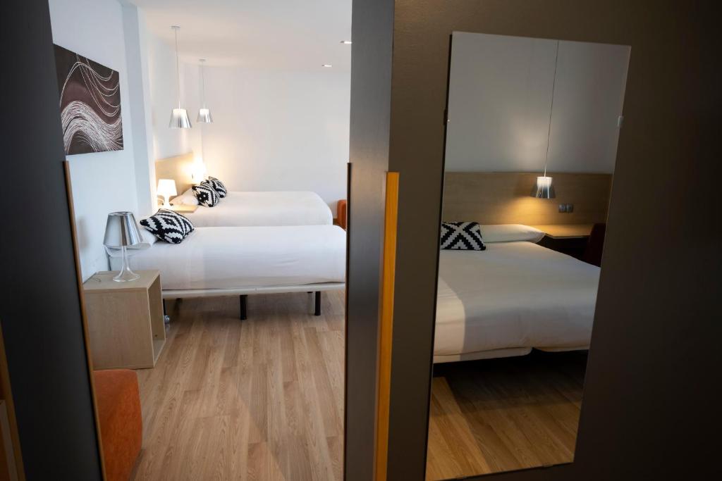 Postel nebo postele na pokoji v ubytování Hotel Restaurante Cadosa