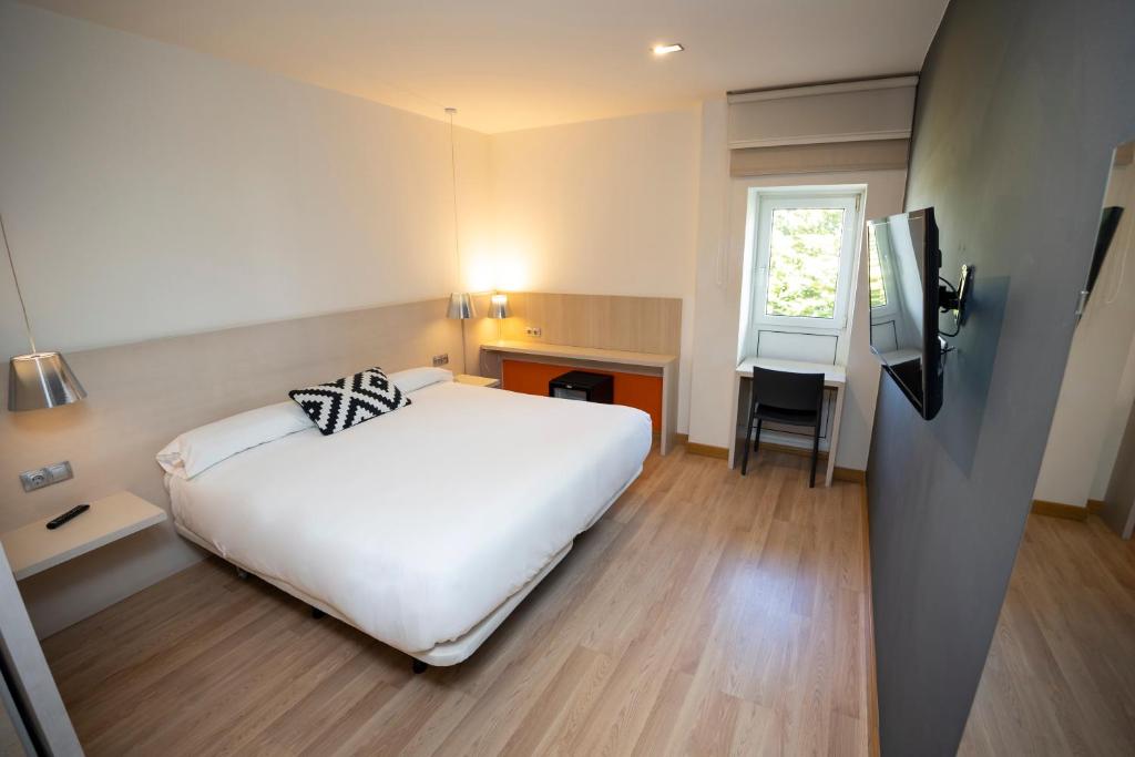 Postel nebo postele na pokoji v ubytování Hotel Restaurante Cadosa