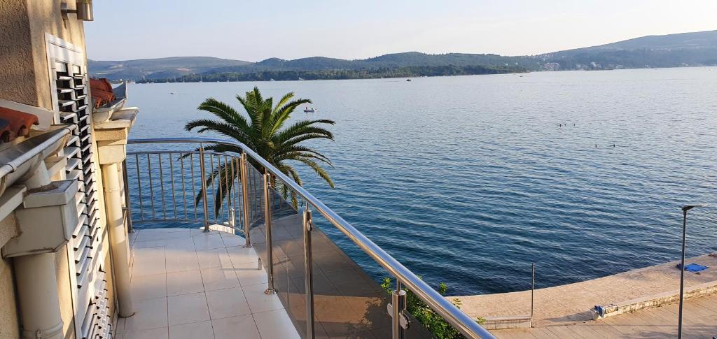 a balcony of a building with a view of the water at Penthouse by the Sea in Tivat