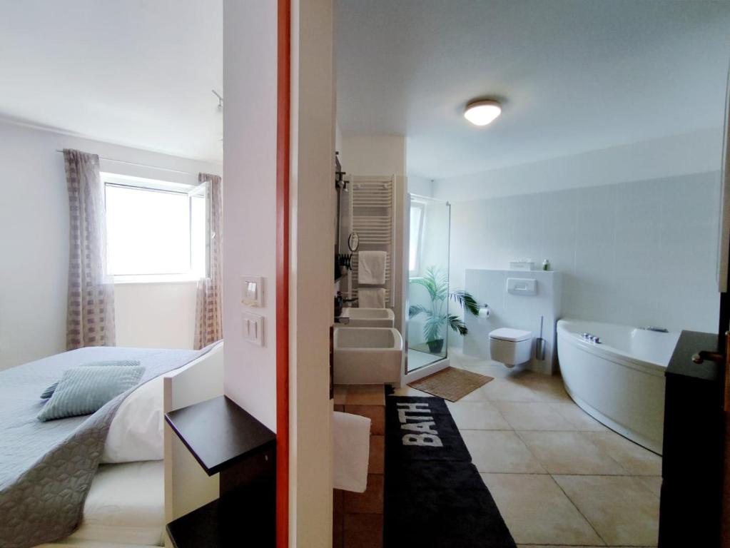 Postel nebo postele na pokoji v ubytování Apartment Teleferica Rabac
