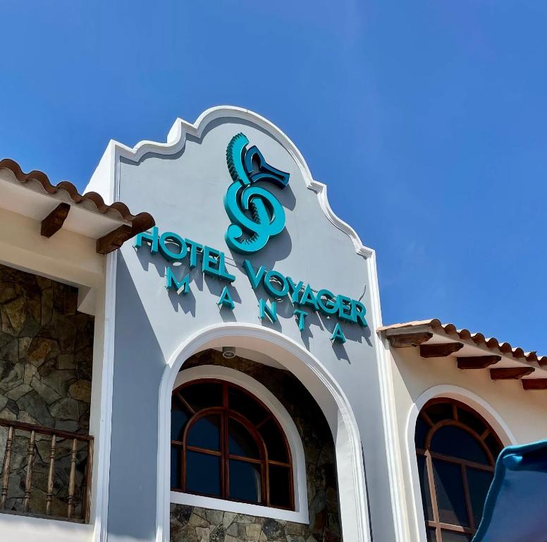 a sign on the front of a hotel room at Hotel Voyager Manta in Manta