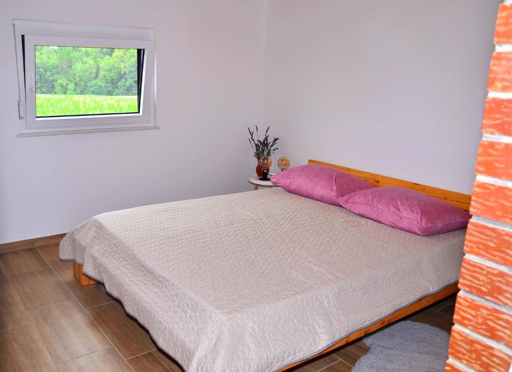 מיטה או מיטות בחדר ב-APARTMA KAPELSKI FANT