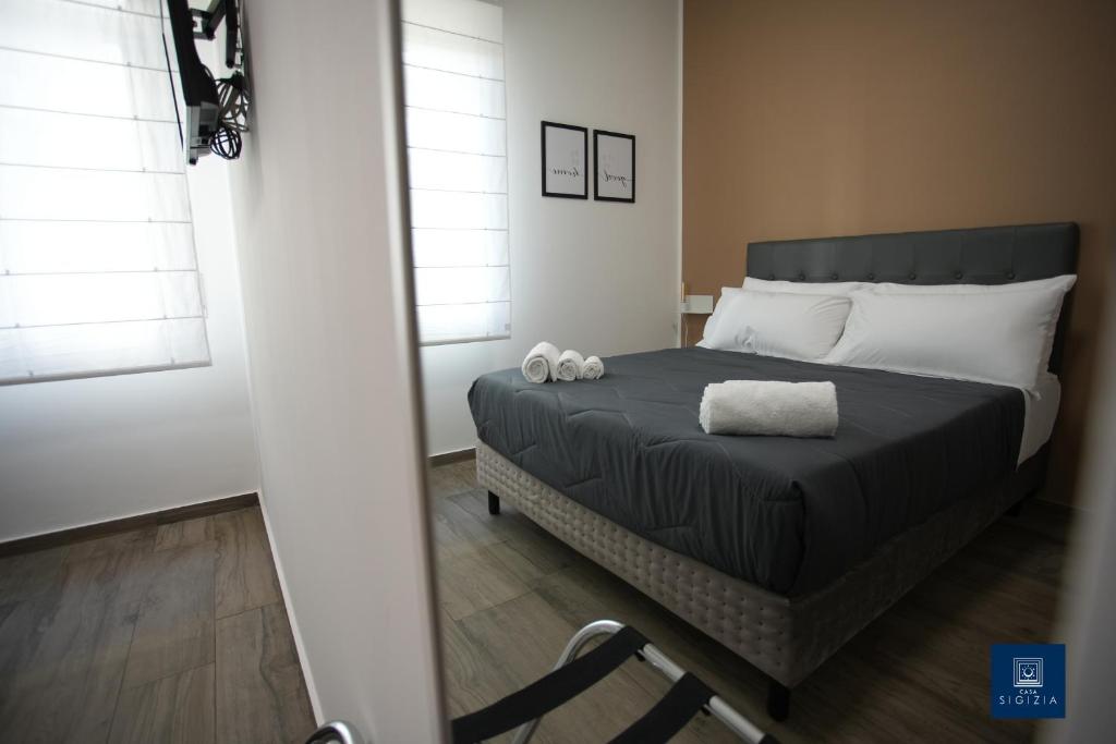 Postel nebo postele na pokoji v ubytování Casa Sigizia