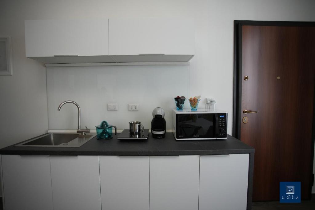 Kuchyň nebo kuchyňský kout v ubytování Casa Sigizia