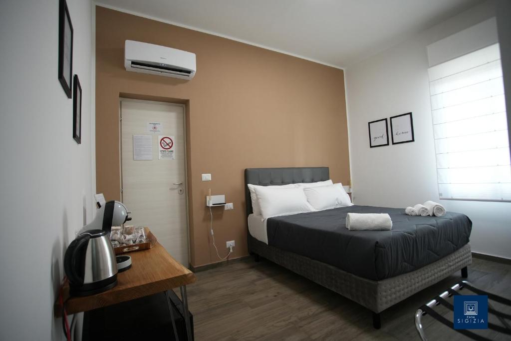 Postel nebo postele na pokoji v ubytování Casa Sigizia
