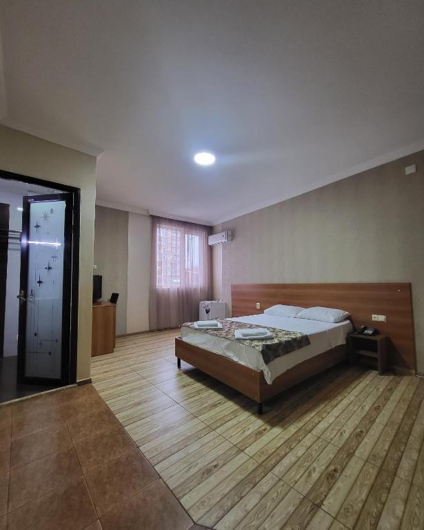 Postel nebo postele na pokoji v ubytování Hotel Elio