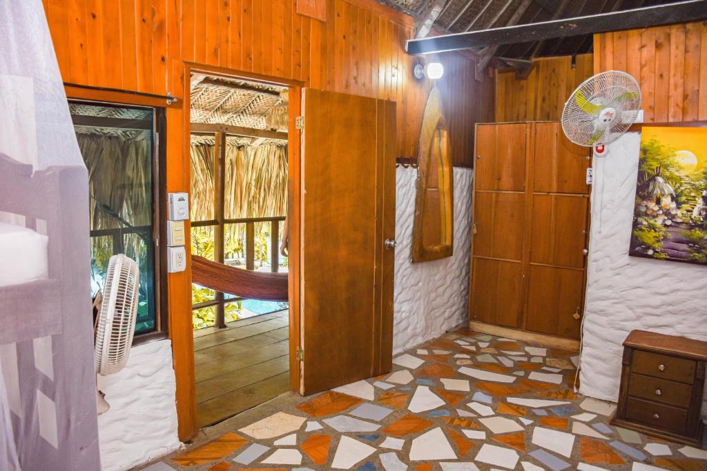 a room with a hallway with a door and a floor at Casa Hostal Villa Del Rio in El Zaino