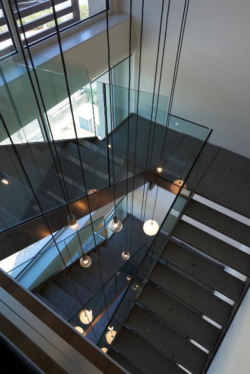 a staircase with a glass ceiling with lights at Hotel B&B il Mosaico in Sirmione