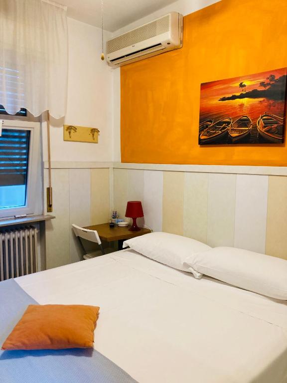 Postel nebo postele na pokoji v ubytování Hotel Moderno