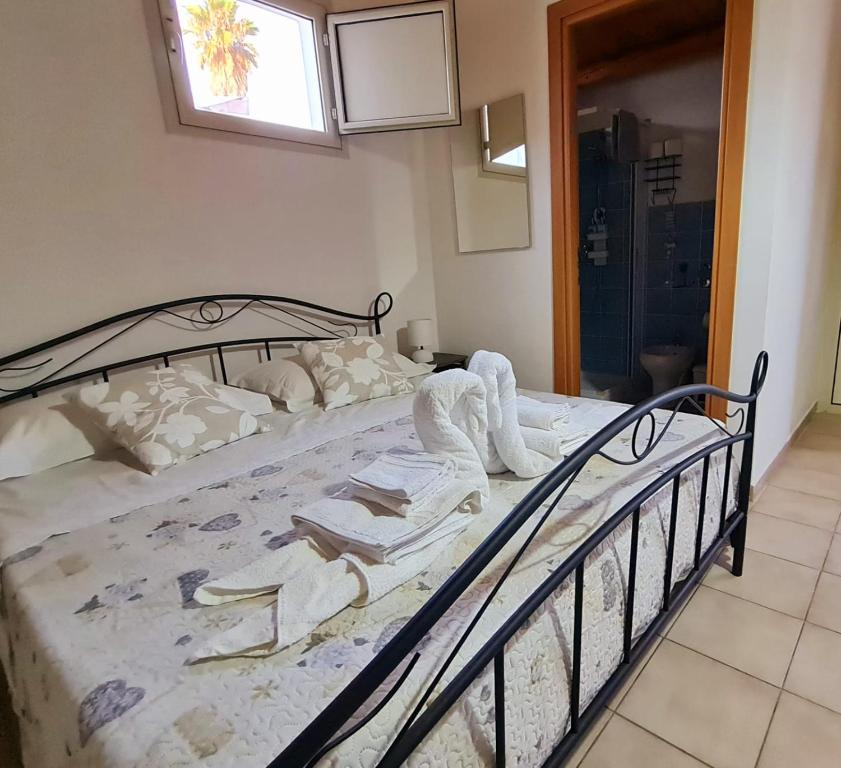 Postel nebo postele na pokoji v ubytování Casa Vacanza Delfino Azzurro - Noto Marina -