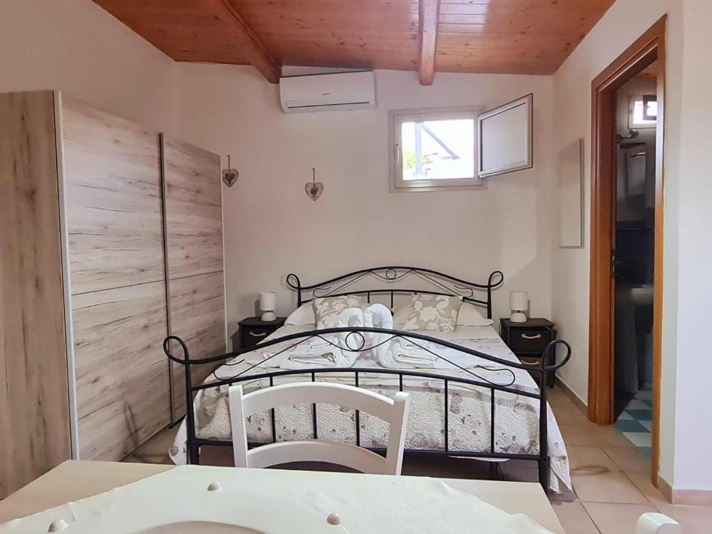 Postel nebo postele na pokoji v ubytování Casa Vacanza Delfino Azzurro - Noto Marina -