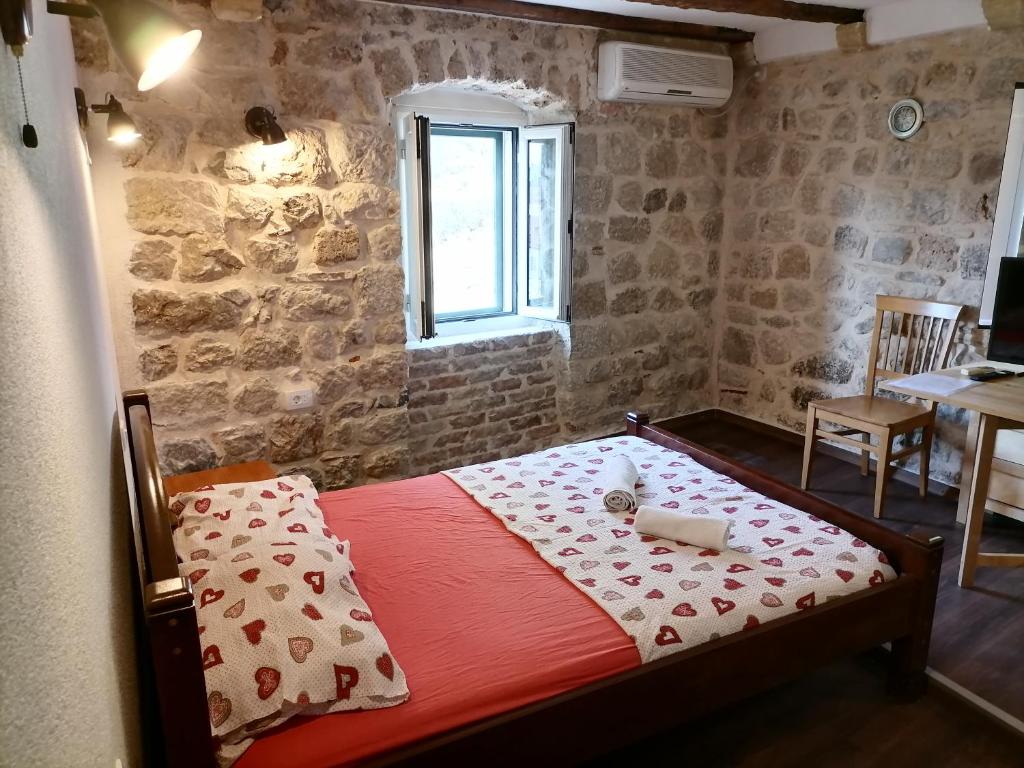 Postel nebo postele na pokoji v ubytování Apartments Đukić
