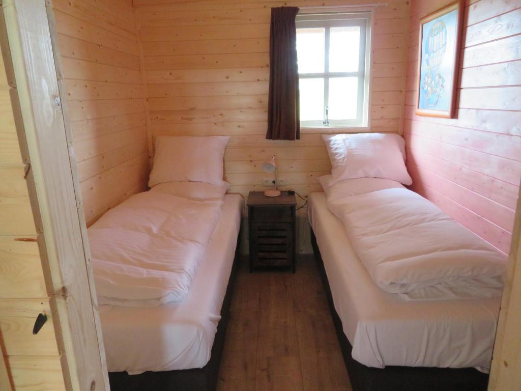 Postel nebo postele na pokoji v ubytování Singelstate het Tuinhuis