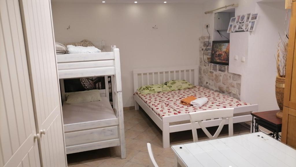Postel nebo postele na pokoji v ubytování Apartments Đukić