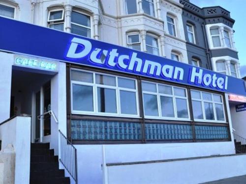 a building with a blue sign for a durham hotel at Dutchman Hotel in Blackpool