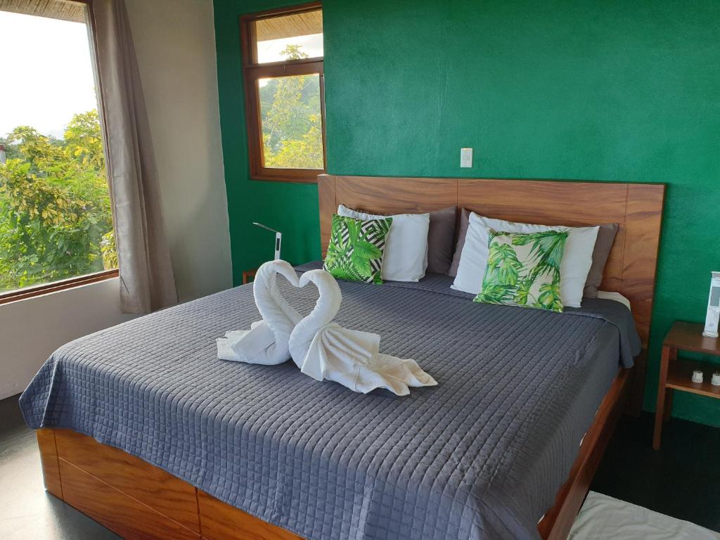 Postel nebo postele na pokoji v ubytování Palmetto Lodge