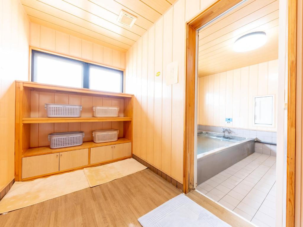 Postel nebo postele na pokoji v ubytování Ryosou Minatosou Joetsu