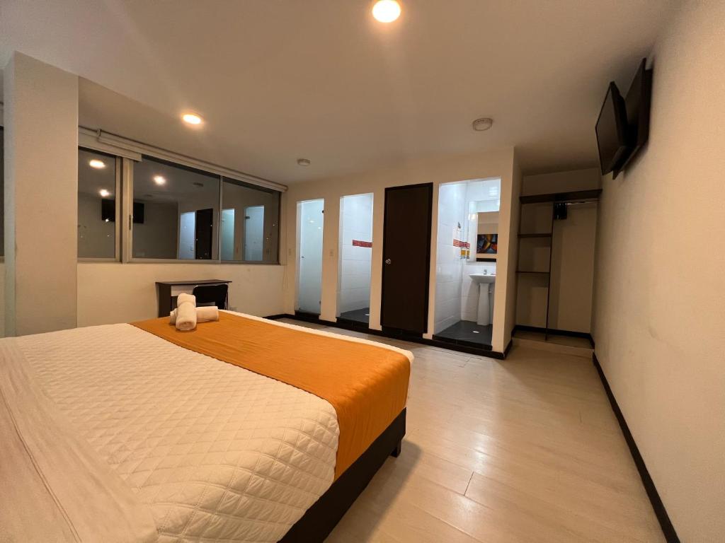 Postel nebo postele na pokoji v ubytování Hotel Ferias Park