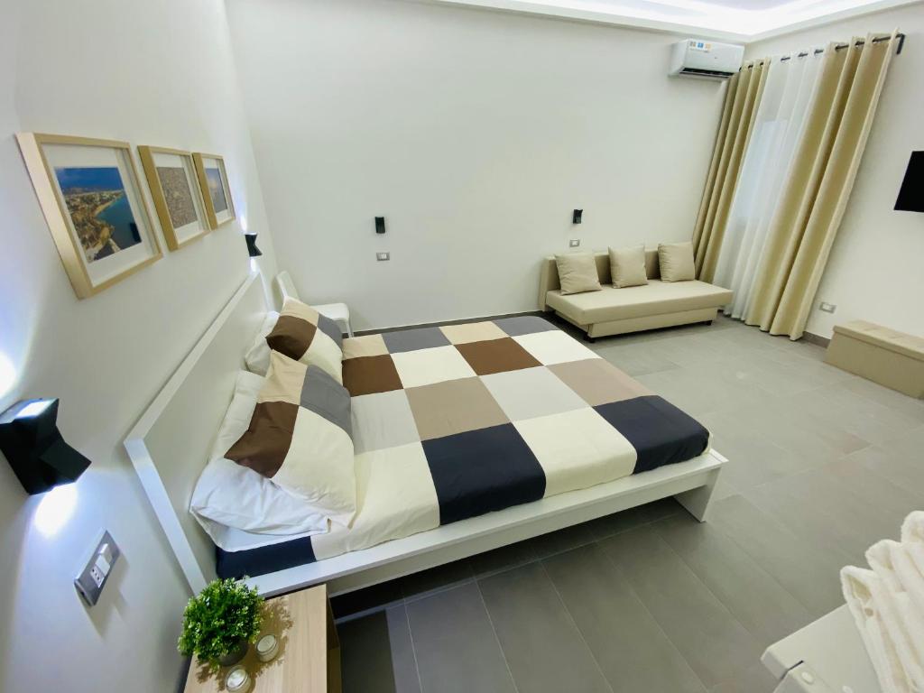 Postel nebo postele na pokoji v ubytování Sicilian Rooms