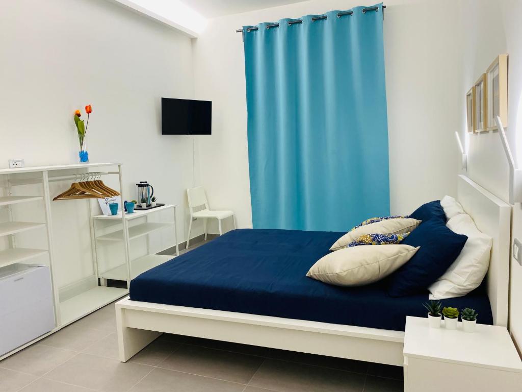 Postel nebo postele na pokoji v ubytování Sicilian Rooms