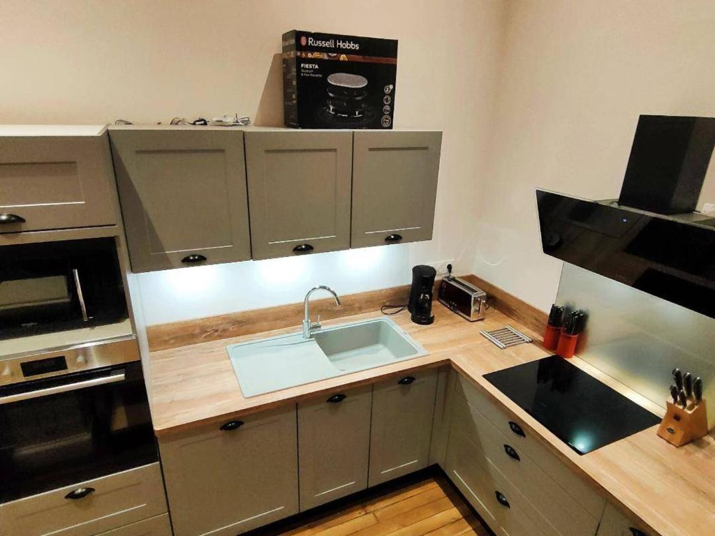 Kuchyňa alebo kuchynka v ubytovaní Appartement haut de gamme 113m², 6/8 pers, plein centre, 4 chambres, prestations de qualité - FR-1-234-280