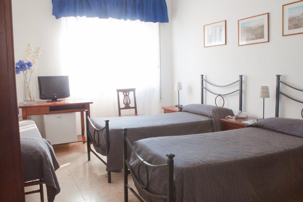 Postel nebo postele na pokoji v ubytování Hotel Antico Acquedotto